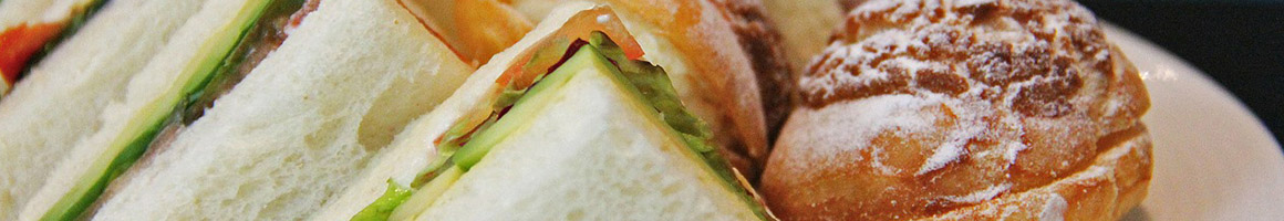 Eating Sandwich at Bagel Oasis restaurant in Seattle, WA.